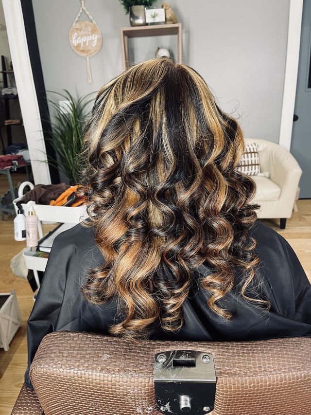 Dimensional curls styled at J Vera